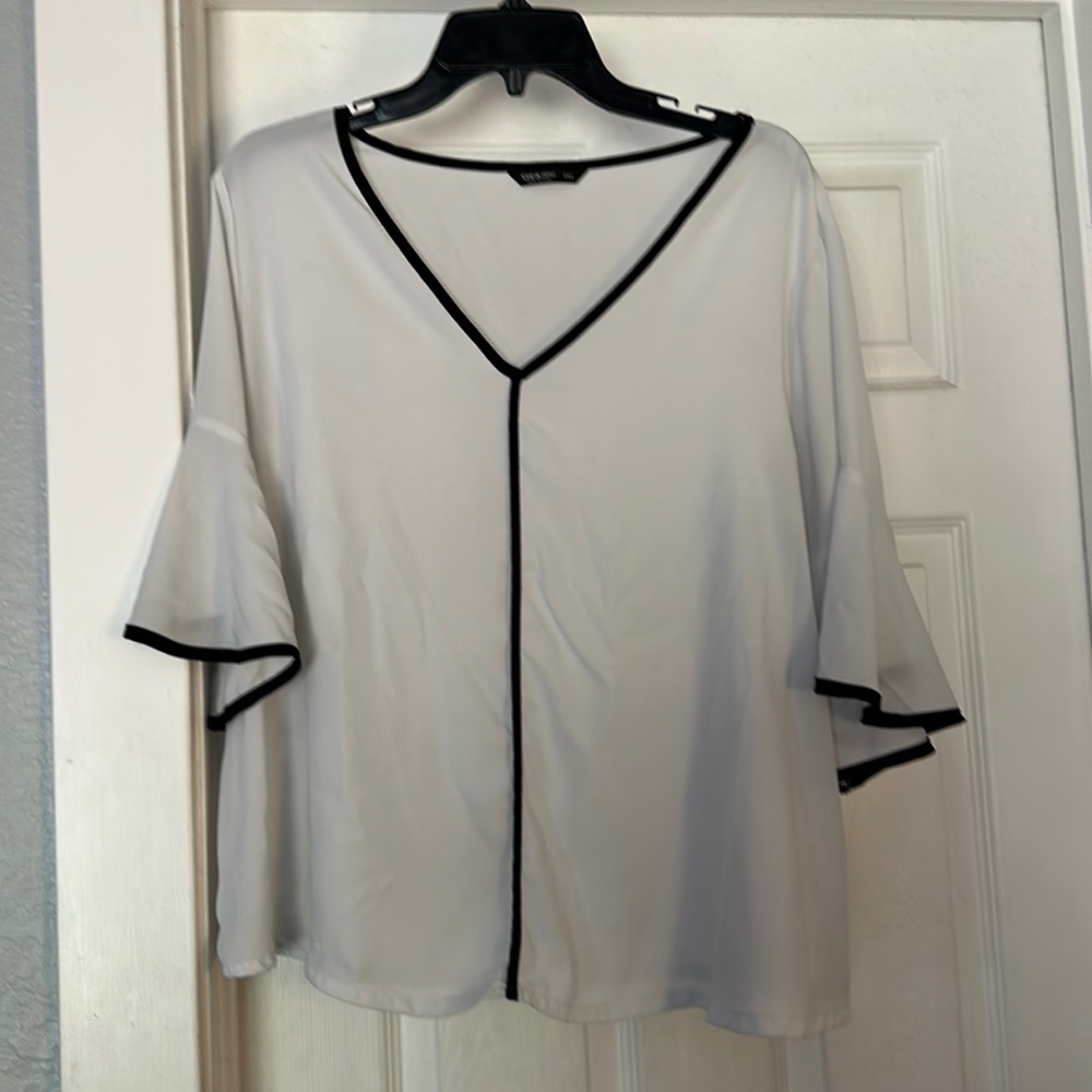 White blouse with black trim